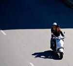 Vespa Passenger making a call on Randolph Street, Chicago, Illinois